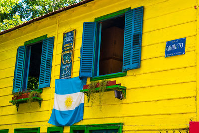 Multi colored residential building against blue wall