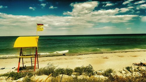 Scenic view of sea against cloudy sky