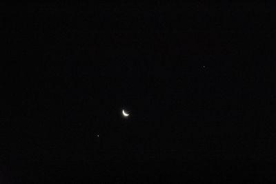 Low angle view of moon against sky at night