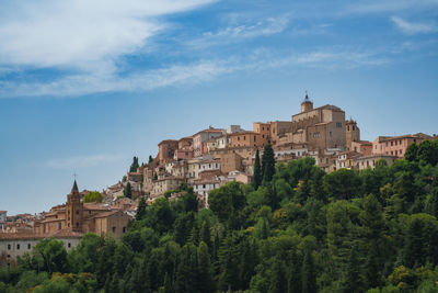 Buildings in city against sky