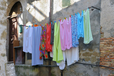 Low angle view of clothes drying against building