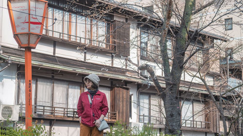 Side view of man standing on street