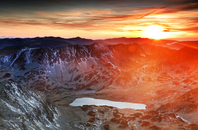 Scenic view of mountains against sky during sunset