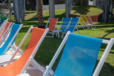 Chairs and tables in swimming pool at park