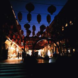 Illuminated buildings in city at night