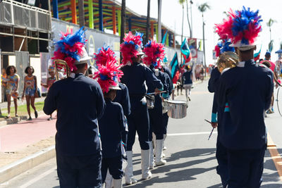 Public school students are seen parading, playing and dancing during the fuzue pre-carnival parade