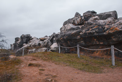 Rock formation on land against sky