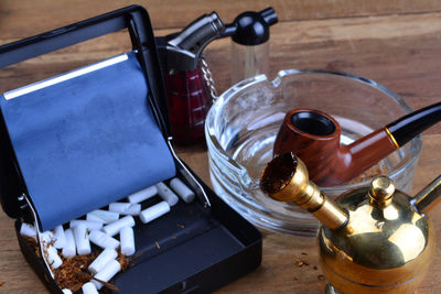 High angle view of cigarette in container on table