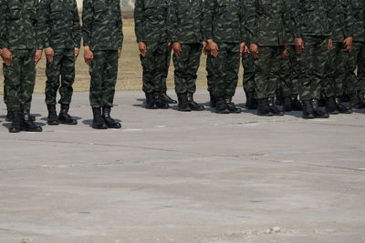 Low section of soldiers standing on road