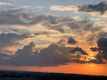 Scenic view of dramatic sky over sea during sunset