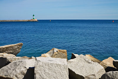 Scenic view of sea against blue sky