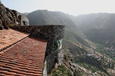 View of building on mountain against sky