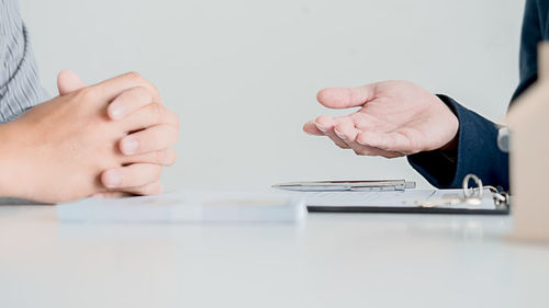 Close-up of hands holding table