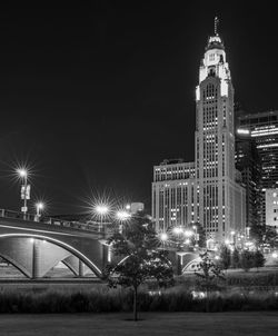 Illuminated buildings in city at night