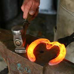 Midsection of man holding fire