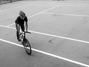 Man riding bicycle on street