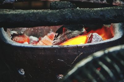 Close-up of burning coal in fire pit