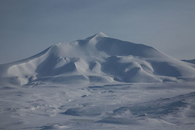 Snow covered mountain against sky