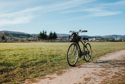 Bicycle parked on field