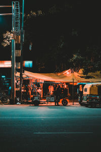 Illuminated city street at night