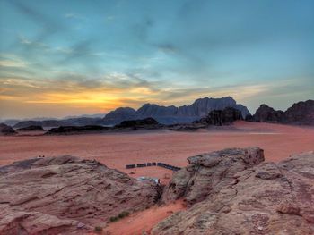 Scenic view of landscape against sky during sunset