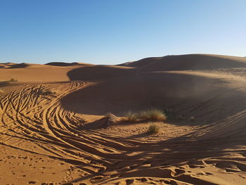 Scenic view of desert against clear sky