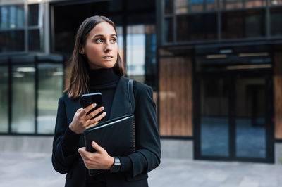 Young woman using mobile phone