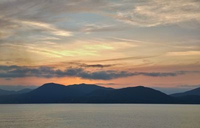 Scenic view of silhouette mountains against sky during sunset