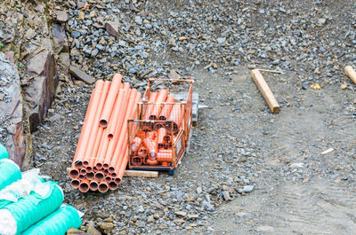 High angle view of stack of pipes