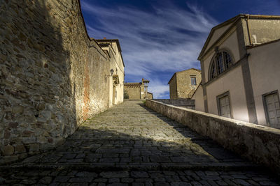 View of alley amidst buildings