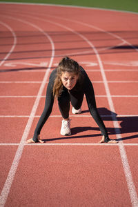 Full length of young woman running