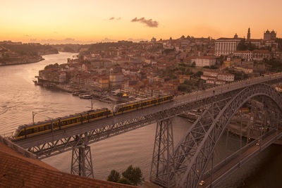 High angle view of train on dom luis i bridge over douro river in city