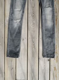 Directly above shot of jeans on wooden table