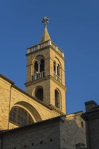 Low angle view of building against clear blue sky