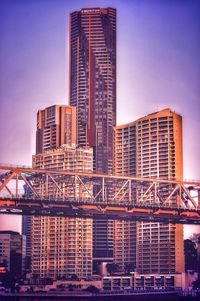 Brisbane city buildings tower above the story bridge