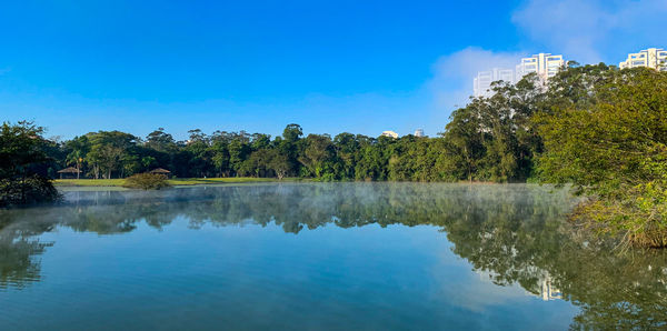 Scenic view of lake against blue sky