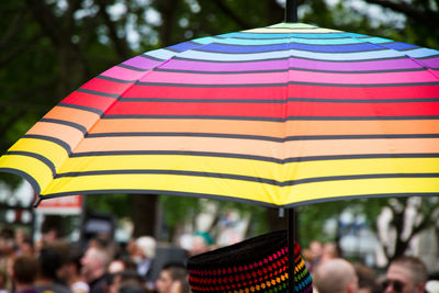 Close-up of multi colored flags against blurred background