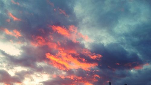 Low angle view of dramatic sky during sunset