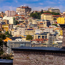 High angle view of buildings in city against sky