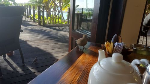 Close-up of table by window