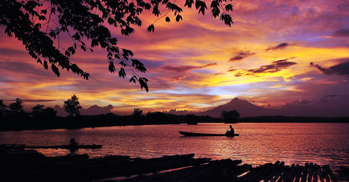 Scenic view of sea against orange sky