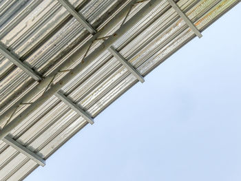 Low angle view of buildings against blue sky