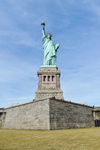 Low angle view of statue against sky