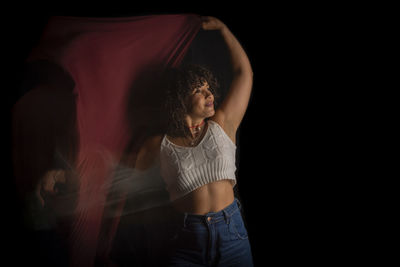 Time-lapse view of woman moving a hat. long exposure, motion blur. 