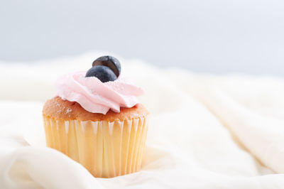 Close-up of cupcakes on cake