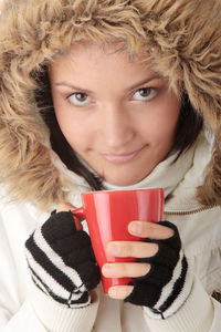 Portrait of woman drinking coffee