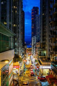 Illuminated city street and buildings at night