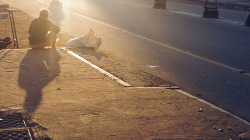 Shadow of woman on road