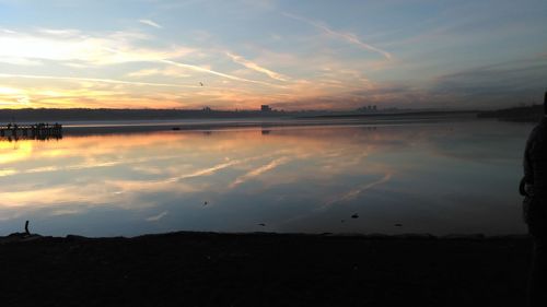 Scenic view of lake against sky during sunset