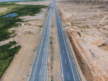 High angle view of road passing through land